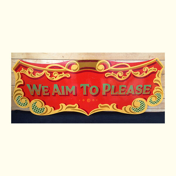 we aim to please Carters Steam Fair sign