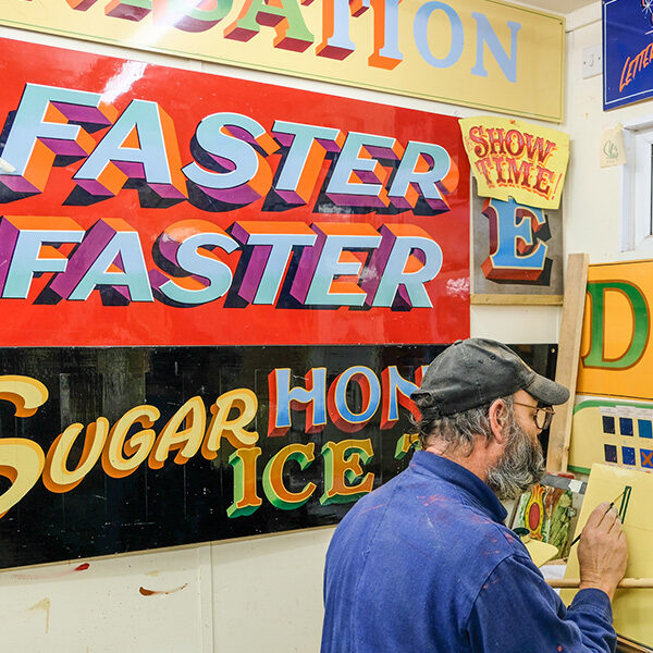 Fancy lettering and fairground art being taught with Carters Steam Fair