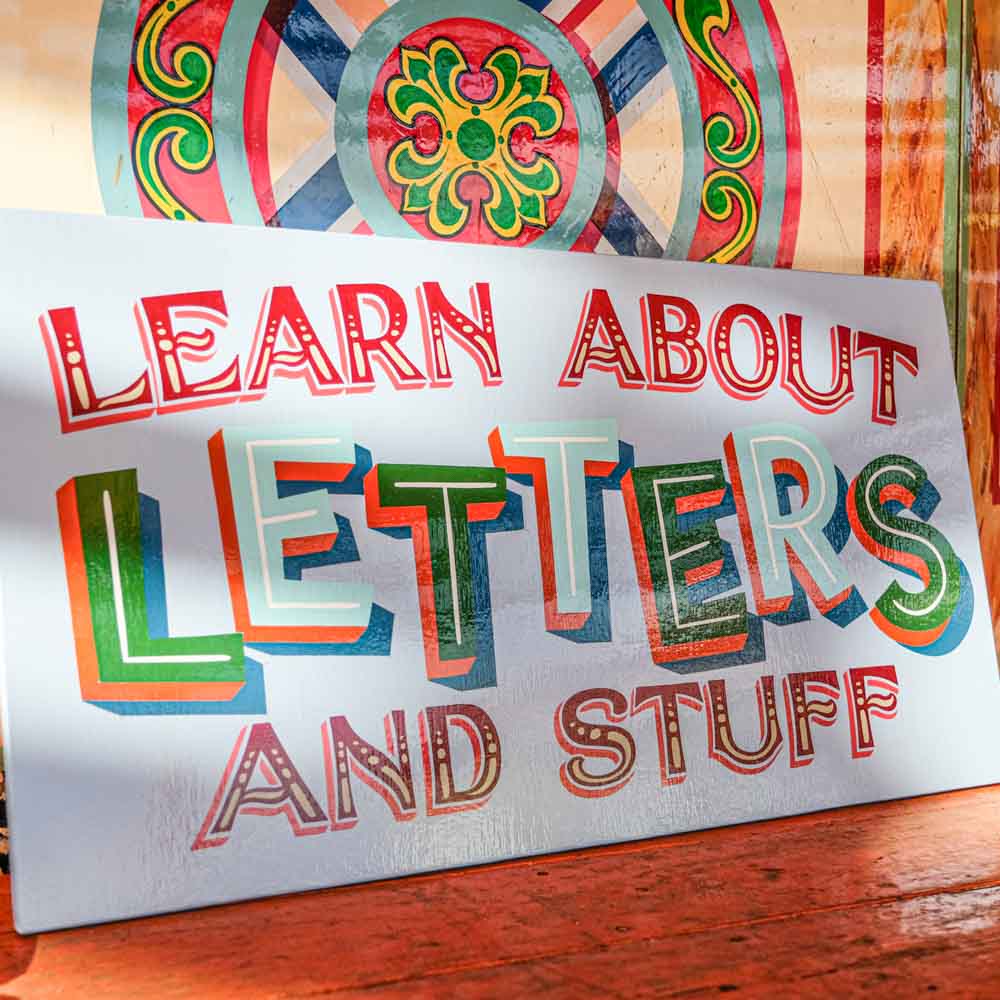 Learn about letters hand painted sign 